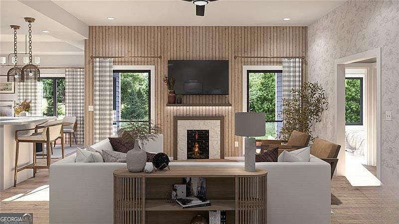 Open-concept living room with fireplace and natural light